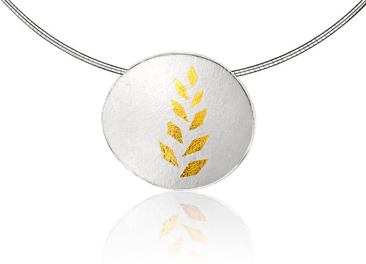 Gold Leaf Pendant - A curved oval sterling silver disc has been richly textured both back and front with a beautiful intricate webbed effect - 24ct gold leaf pattern on top