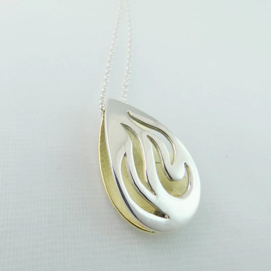  Bealtaine Pendant - shaped like the flames of fire - silver and brass - banshee silver 