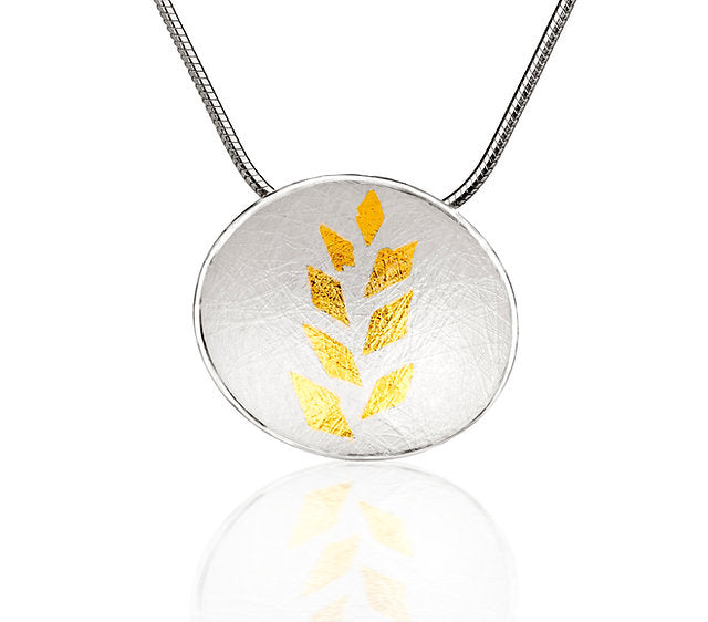 Gold Leaf Small Pendant - A curved oval sterling silver disc has been richly textured both back and front with a beautiful intricate webbed effect - 24ct gold leaf pattern on top